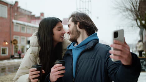 young people kissing on the street