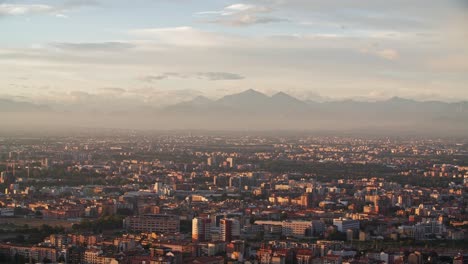 foggy grigne mountains and milan cityscape, view from above