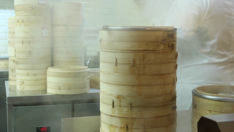 steaming dim sum in a busy kitchen