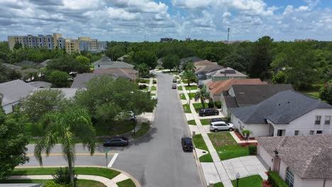 suburban neighborhood with neat single-family homes, well-maintained lawns, and tree-lined streets