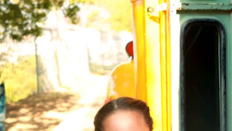 Schoolgirl-getting-down-from-bus