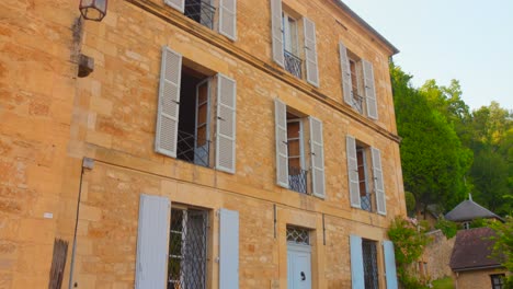 discover the stunning architecture of beynac in france, featuring low-angle views of its medieval buildings. experience the timeless beauty and rich history in this picturesque village