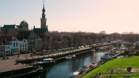 aerial: the historical town of veere with an old harbour and churches, on a spring day