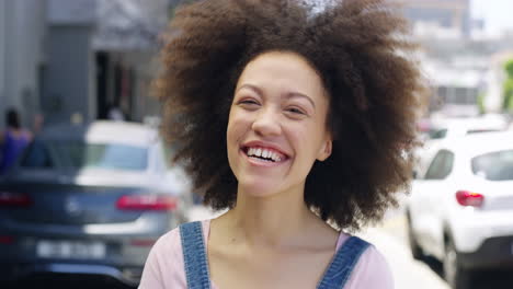 a-young-woman-laughing-while-out-in-the-city