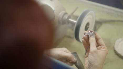 polishing a jewelry piece