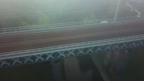 early morning foggy mist railway bridge - arches