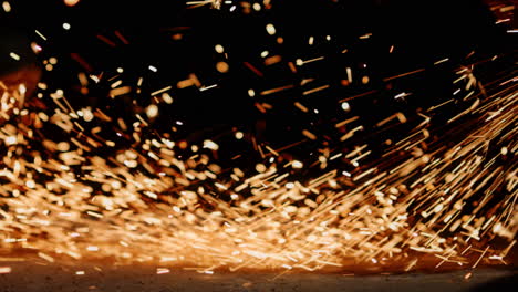 Vibrant-sparks-dash-away-from-the-angle-grinder,-creating-a-mesmerizing-display-of-brilliance-in-a-close-up-shot