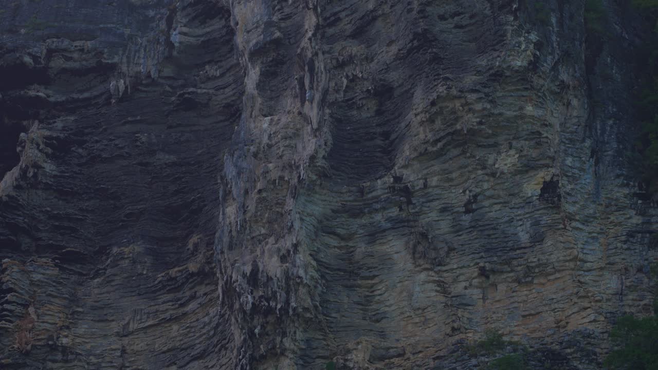Detailed view of a karst rock face in Thailand, highlighting vertical formations and rugged geological textures shaped over time
