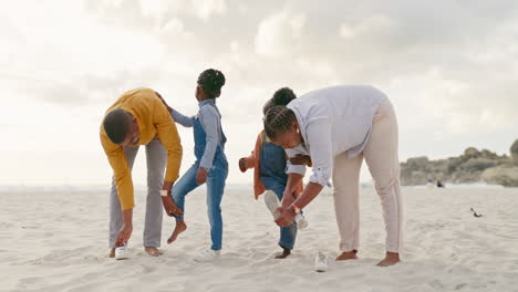 summer, sand and a black family at the beach