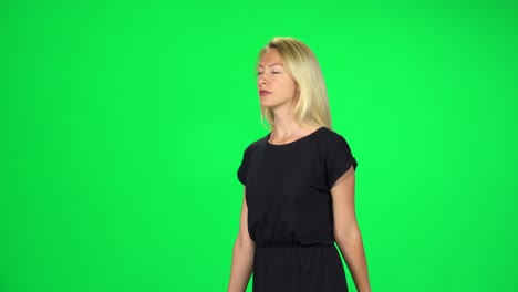 woman in black dress on green screen