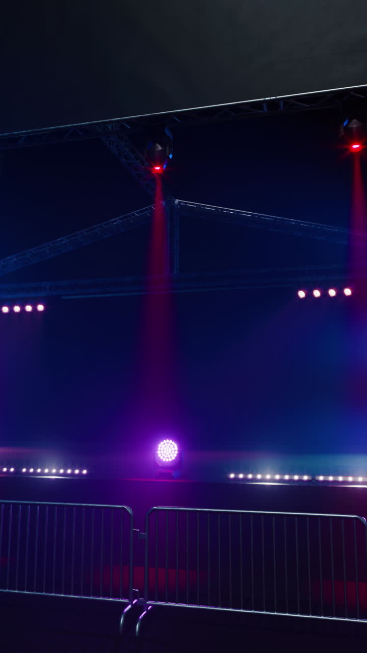 Empty Concert Stage with Pink and Blue Lighting