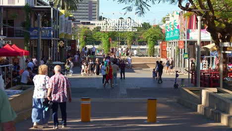 people visiting south bank parklands on the weekend, brisbane's premier dining, lifestyle and cultural destination along the river.