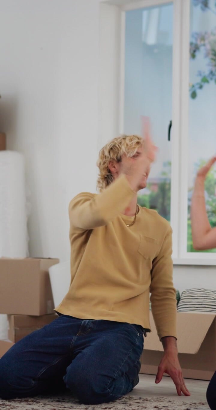 Happy Couple Celebrating Moving Into New Home