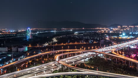 urban night scene with illuminated highways and city skyline