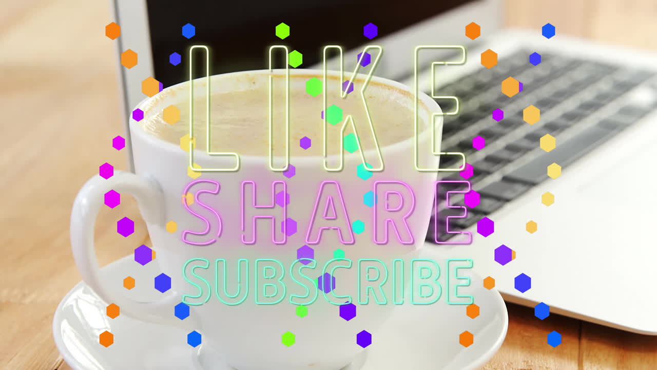 Coffee cup sitting by open laptop, hexagon confetti floating with neon LIKE SHARE SUBSCRIBE text