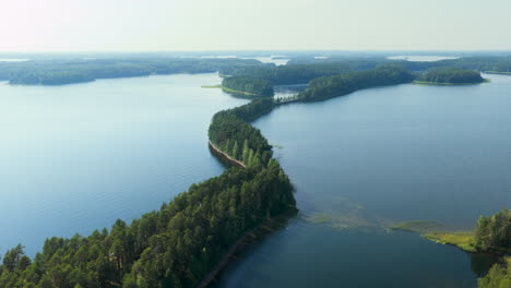 aerial view approaching the museotie road, sunny day in punkaharju, finland