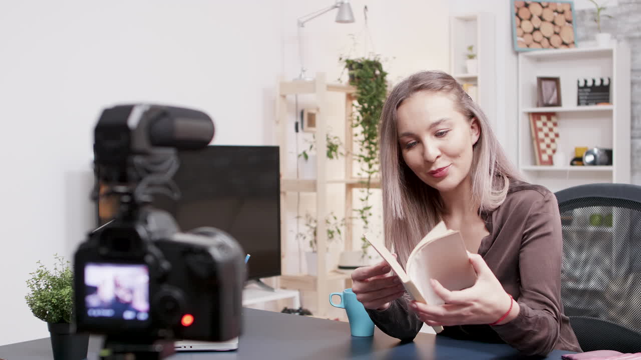 Woman vlogging about books