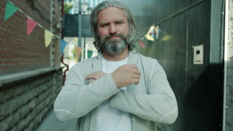 portrait of a man in an urban alley