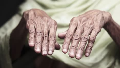 wrinkled hands of an elderly person