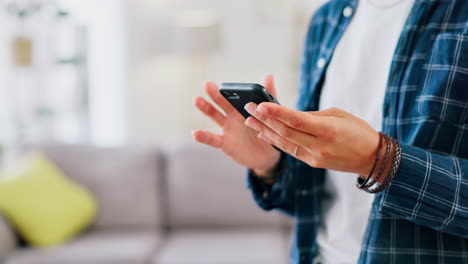 Woman-hands,-smartphone-and-typing-in-home