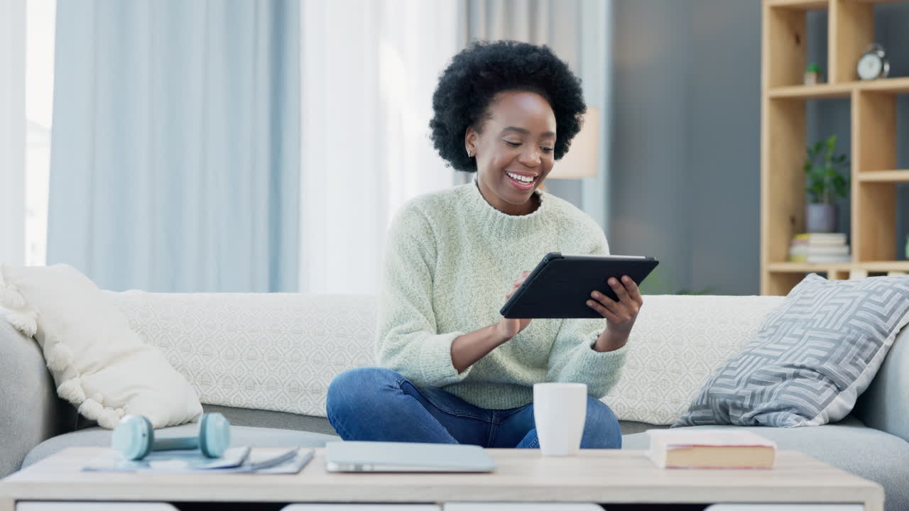 Woman using a digital tablet at home