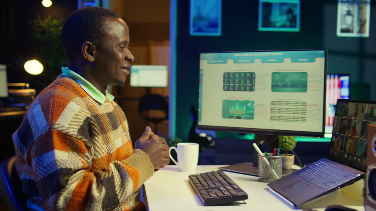 Man working from home on computer with video call