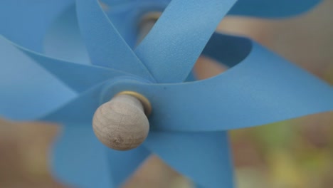 blue garden windmill blows in breeze