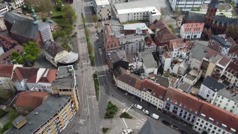 pedestrians people crossing empty street intersection on sunday morning in kaiserslautern old city