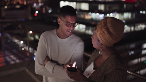 night, man and black woman with smartphone