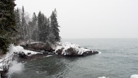 winter weather on icy lake superior rocks