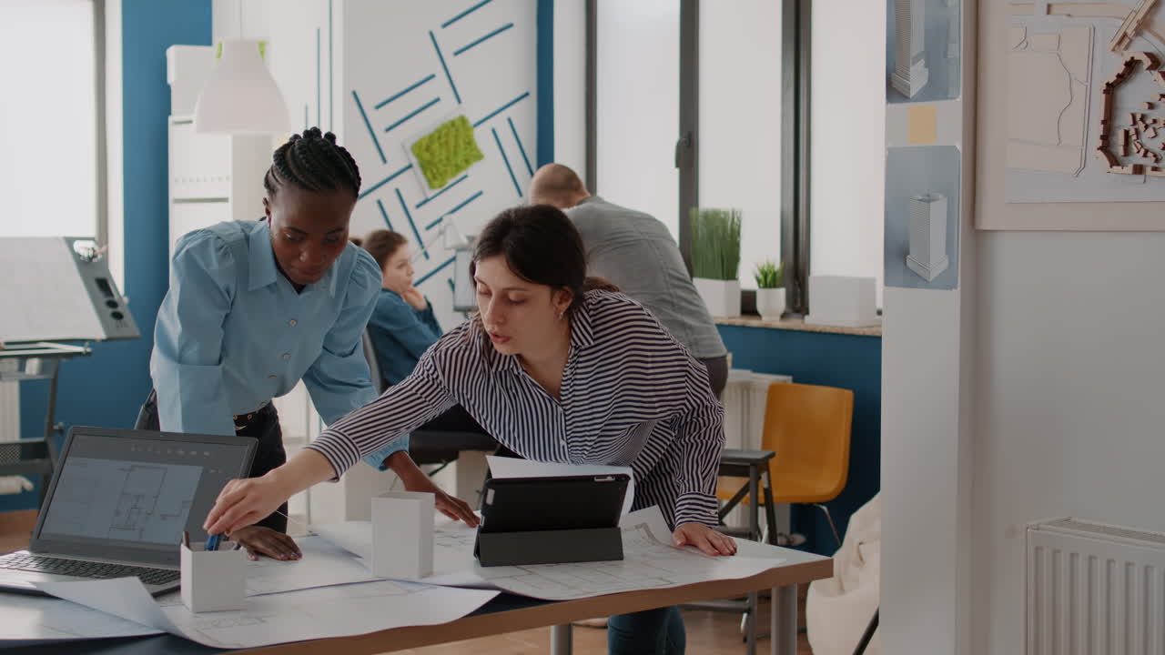 Architects collaborate on design project in office