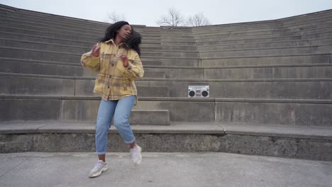 Black-woman-listening-to-music-and-dancing