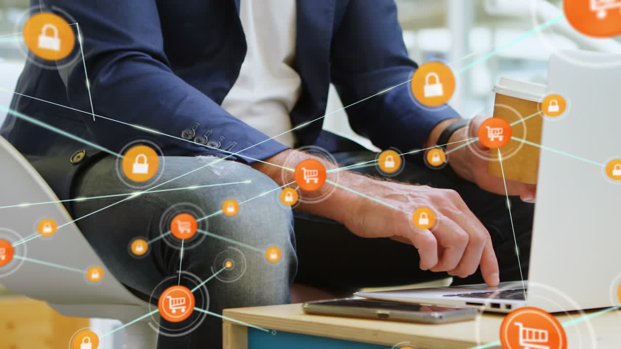 animación de la red de iconos digitales sobre la sección media del hombre de negocios que utiliza la computadora portátil en la oficina.