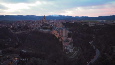 aerial view of segovia alcazar and city during sunrise in winter cold morning