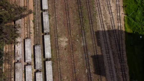 from above, we capture the intricate network of tracks snaking their way through the urban landscape, a testament to colombia's railway history