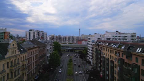 magic aerial top view flight city berlin suburban railroad station prefabricated building skyscrapers district neukoeln, germany summer day 2023