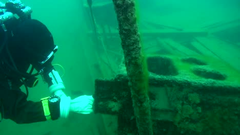 scuba diver explores the woodstove on goldrush paddlwheel aj goddard