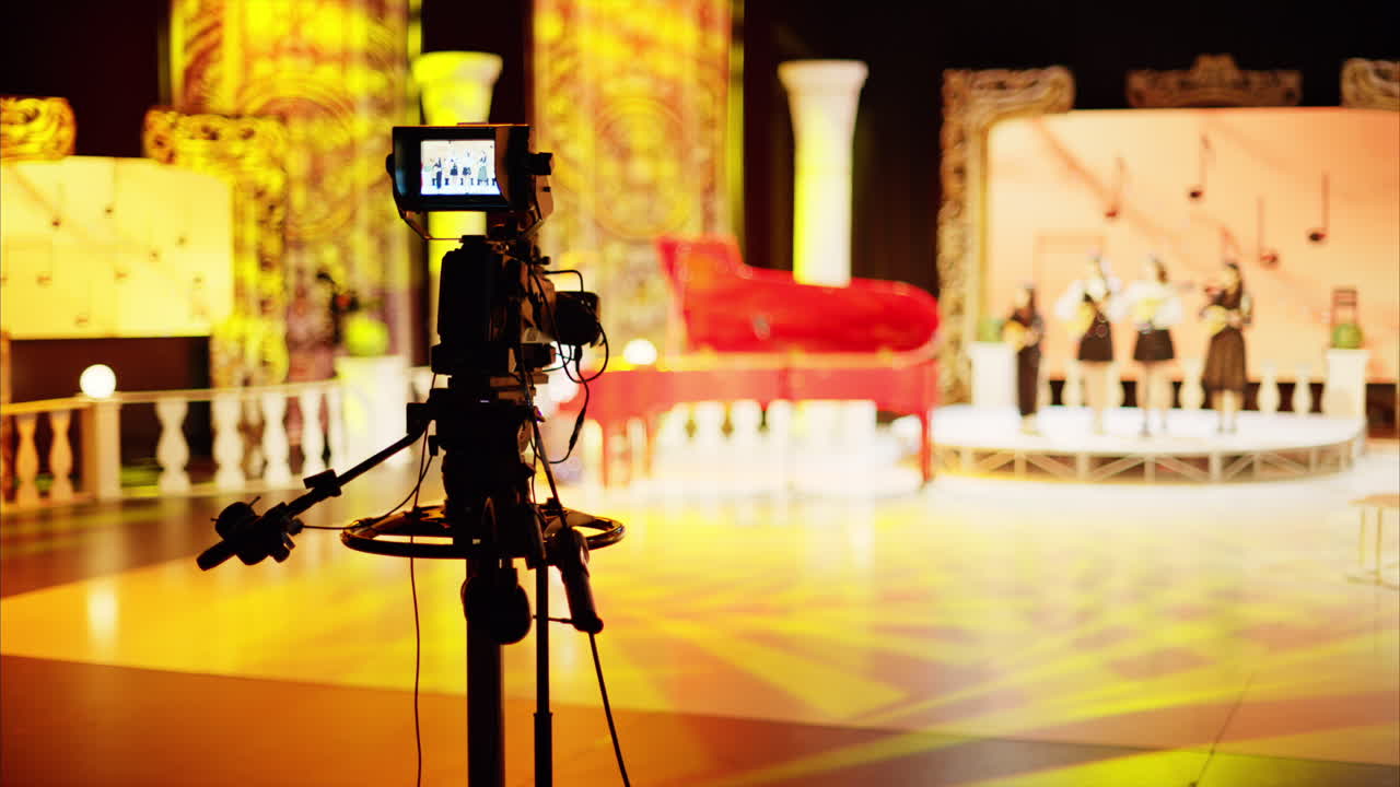 Professional camera filming with on the backstage of a TV set