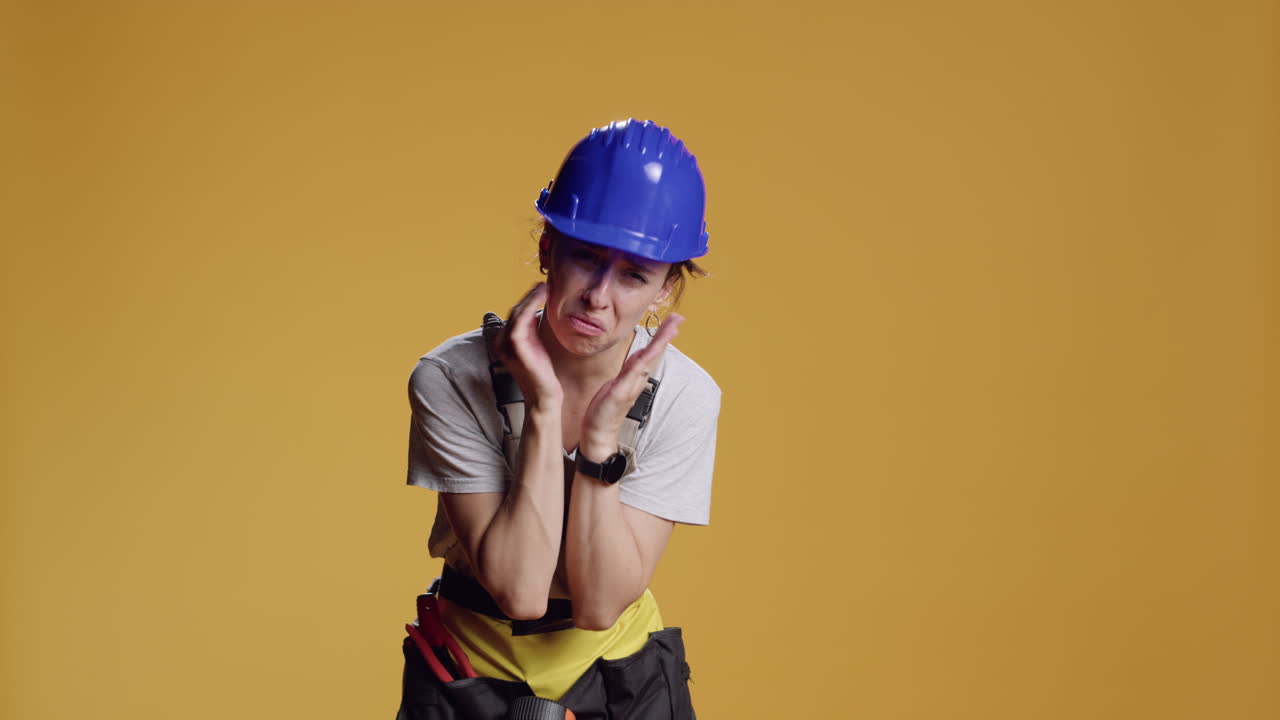 Portrait of female contractor praying to ask for fortune