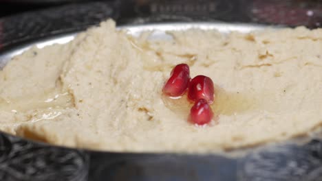 hummus with pomegranate and pita bread