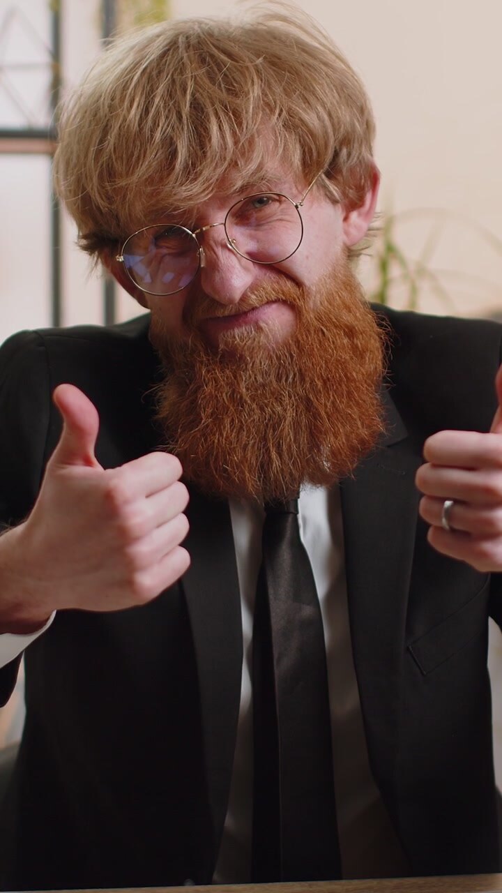 Upset businessman showing thumbs down dislike bad work disapproval dissatisfied feedback at office