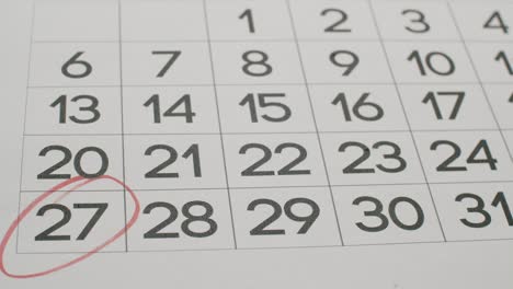 calendar 27th date of the month crossed out. signing a day on a calendar.