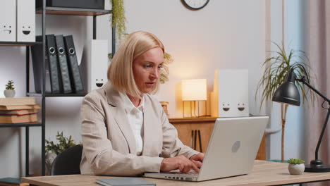 displeased sad businesswoman using laptop becoming surprised lottery results bad news computer virus