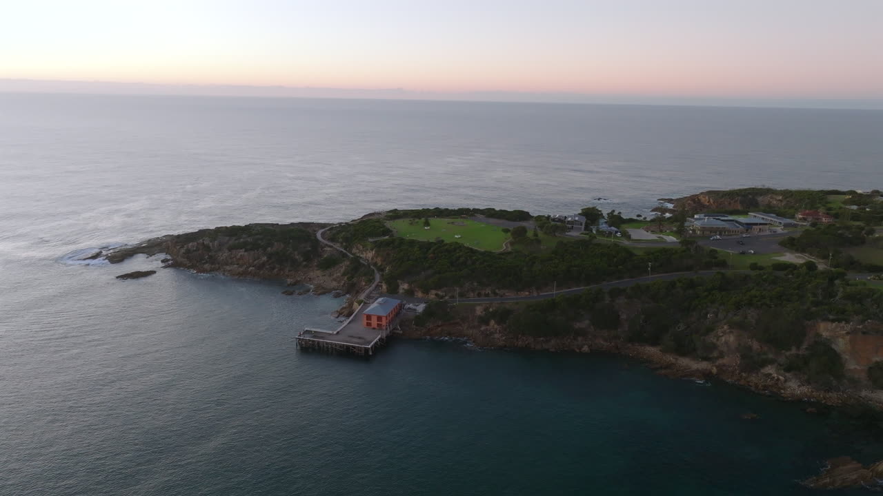 Aerial: High angle shot of the Tathra Wharf during early morning on South Coast, NSW, Australia