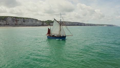 sailing boat near cliffs in france