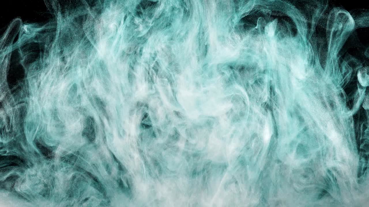 Abstract forms. Shooting on a black background. Mixing of paints