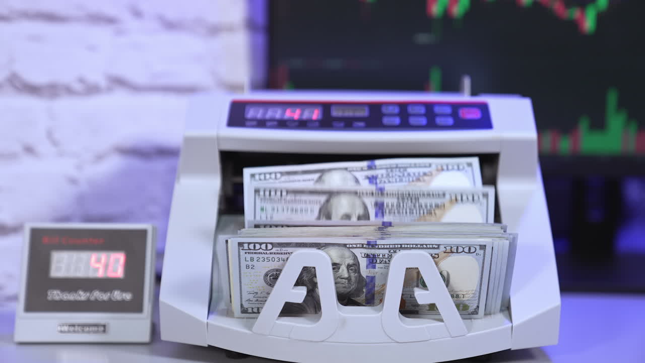 Finance business money counting. Cropped view of the person putting money at the bank cash counter machine. Money concept