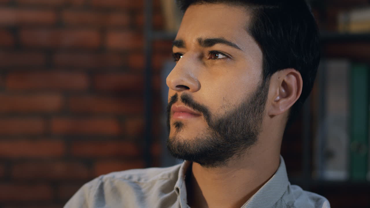 Close Up View Of Arabian Businessman With A Beard Turning His Head To The Camera And Smiling