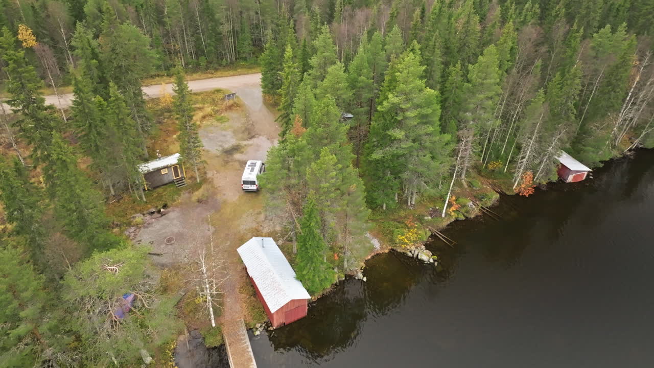 Van Parked On Lake Shore With Autumn Trees In Sweden