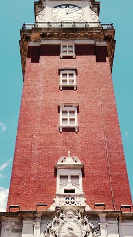 vertical view monumental english clock tower of buenos aires city argentina, landmark building low angle close up